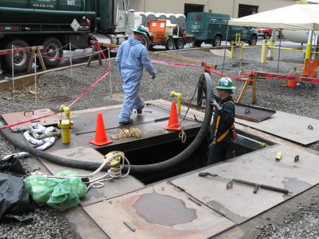 Waste workers perform facility maintenance work