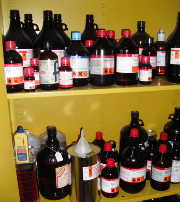 Chemical cabinet with brown chemical bottles for inventory