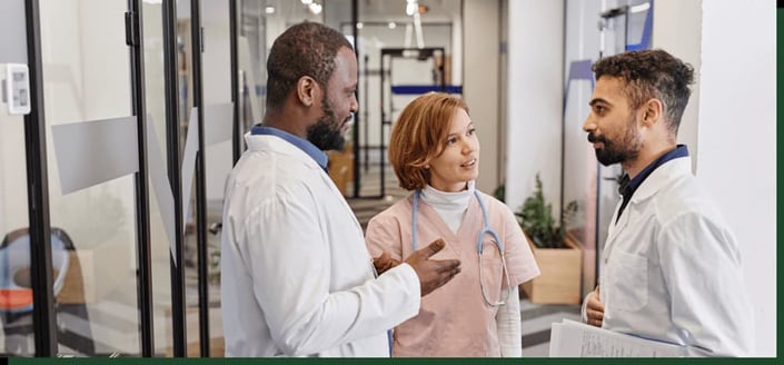A group of pharmacists and physicians discussing pharmaceuticals.