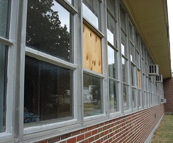 School with a few bordered up windows