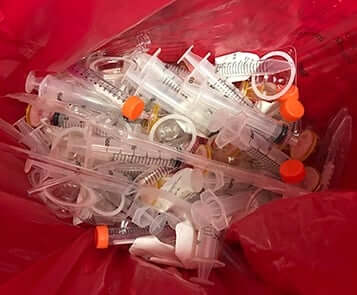 Medical waste material to be recycled into plastic lumber