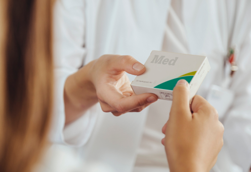 Pharmacist giving medication