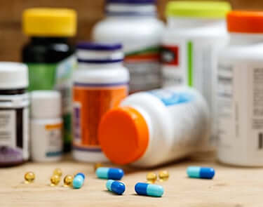Spilled pills near DEA controlled substance bottles