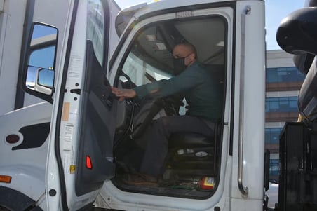 triumvirate-environmental-driver-in-truck