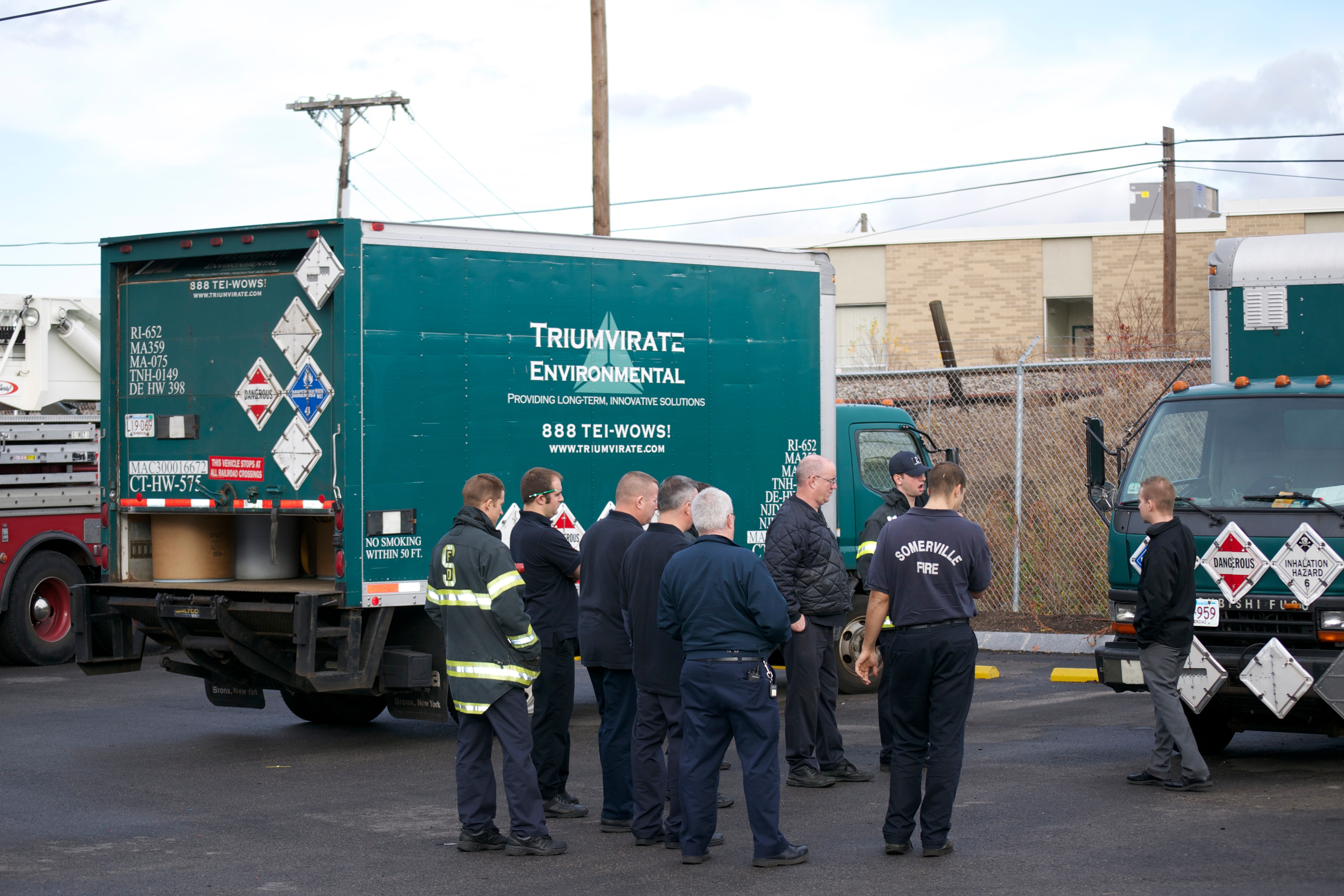 Triumvirate Environmental workers near truck