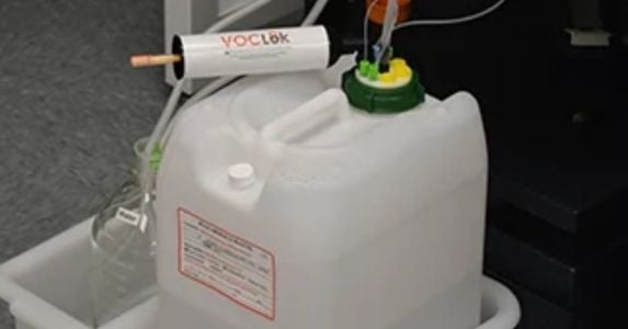 Safe closed container HPLC waste system secured with a VOCLok solution