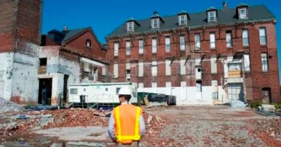 construction worker walking with hardhat and safety vest