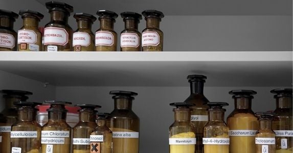 Two neatly organized shelves of correctly inventoried chemicals
