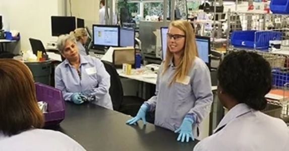 employees meeting in lab facility