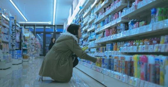 woman browsing merchandise at a pharmacy