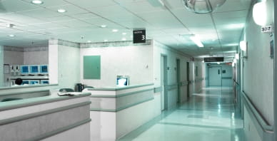 White hospital hallway with receptionist desk