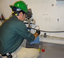 EHS worker testing wastewater system