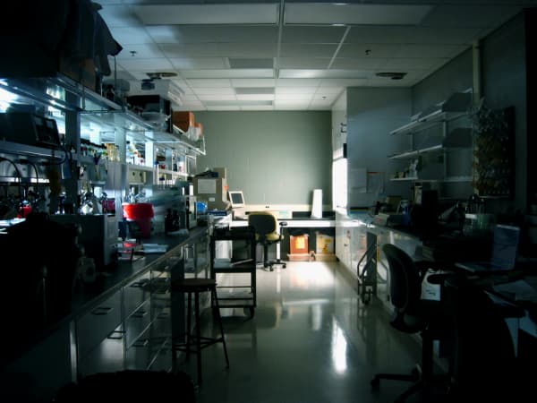 Dark laboratory with light on in the background