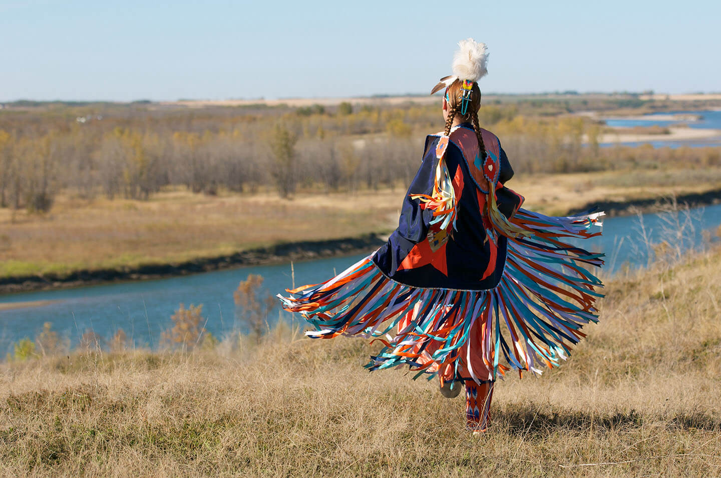 indigenous woman traditional dress near river ehs environmental activist