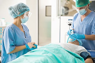 Nurses prepare patient for surgery 